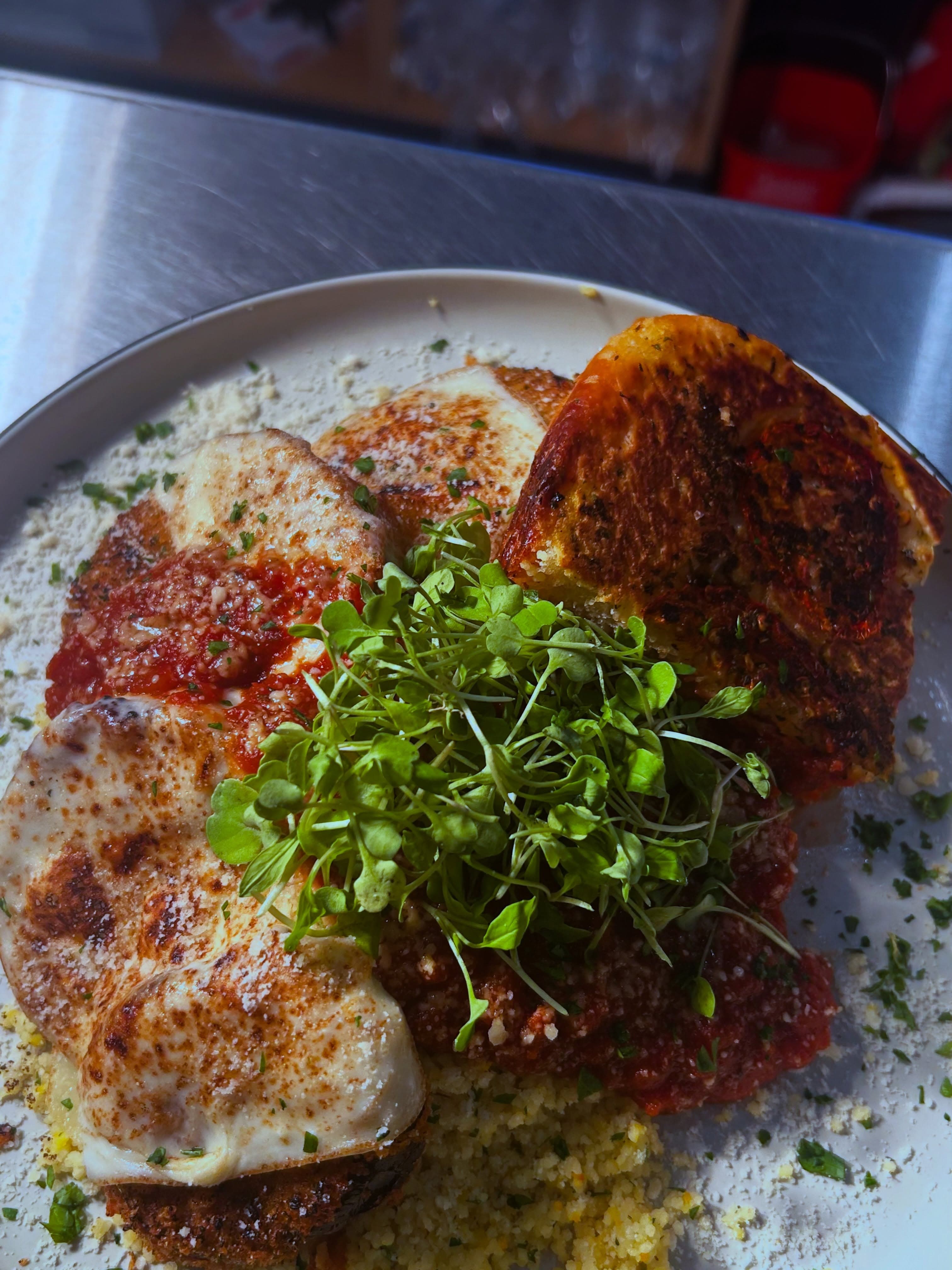 Chicken parmesan plated by the Magic Food Bus