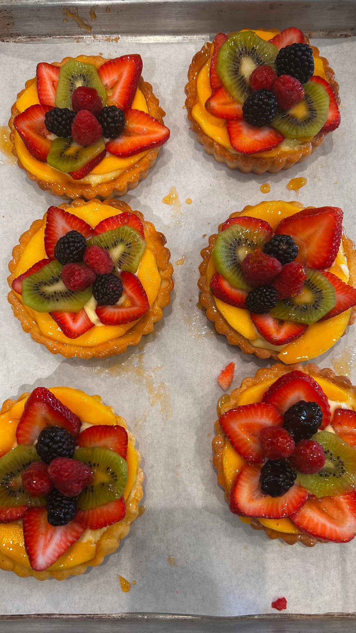 House-made fruit tarts topped with strawberries, kiwi, and fresh berries
