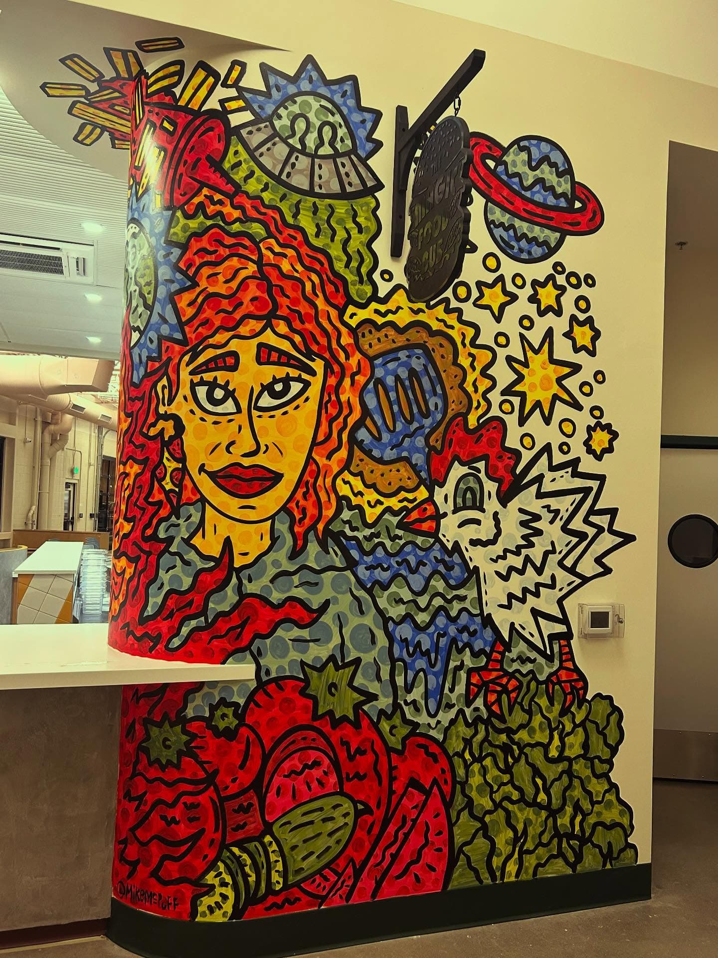 The colorful mural at our counter inside Relish Food Hall in Louisville, Colorado