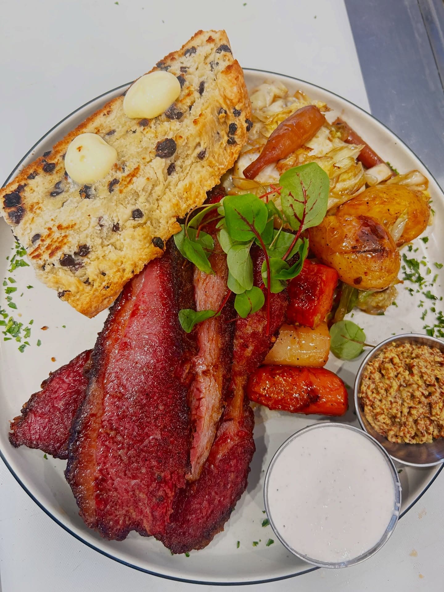 A weekly special: corned beef with braised cabbage, potatoes, and house soda bread